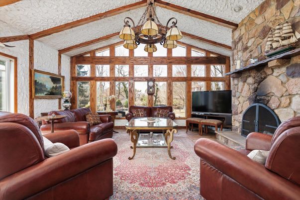 Chandelier, Fireplace, Interior, Living room, Stone Walls