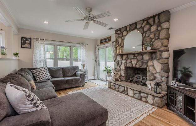 Fireplace, Interior, Living room, Recessed Lighting, Stone Walls, Wood Texture Flooring