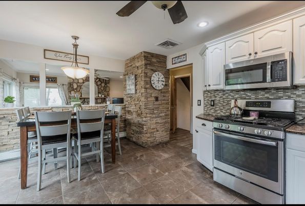Dining room, Interior, Kitchen, Pendant Lights, Recessed Lighting, Stainless Steel Appliances, Stone Walls