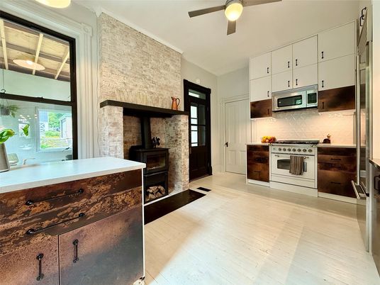 Fireplace, Interior, Kitchen, Stainless Steel Appliances, Stone Walls, Wood Texture Flooring