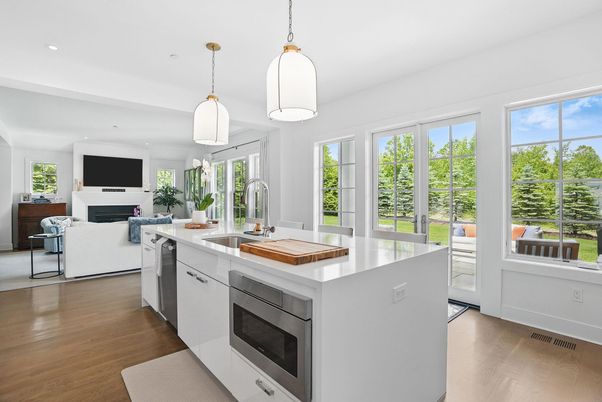 Fireplace, Interior, Kitchen, Living room, Pendant Lights, Recessed Lighting, Stainless Steel Appliances, Wood Texture Flooring