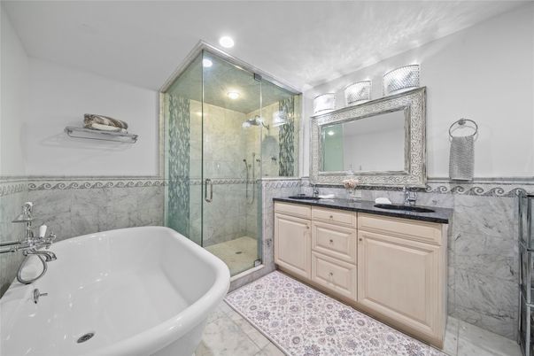 Bathroom, Dual Sink Vanities, Free Standing Baths, Glass Shower, Interior, Marble Walls, Recessed Lighting