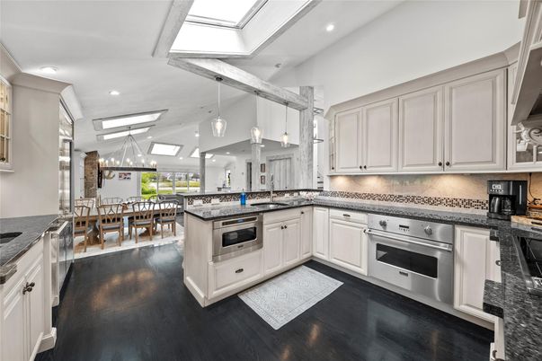 Dining room, Interior, Kitchen, Pendant Lights, Recessed Lighting, Stainless Steel Appliances, Wood Texture Flooring