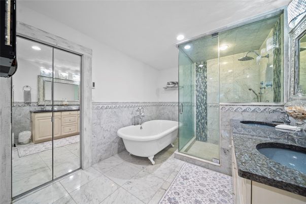 Bathroom, Dual Sink Vanities, Free Standing Baths, Glass Shower, Interior, Marble, Marble Walls, Recessed Lighting