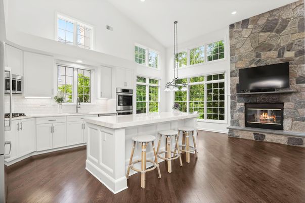 Fireplace, Interior, Kitchen, Pendant Lights, Recessed Lighting, Stainless Steel Appliances, Stone Walls, Wood Texture Flooring