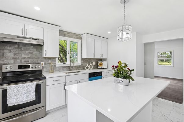 Interior, Kitchen, Marble, Pendant Lights, Recessed Lighting, Stainless Steel Appliances, Wood Texture Flooring