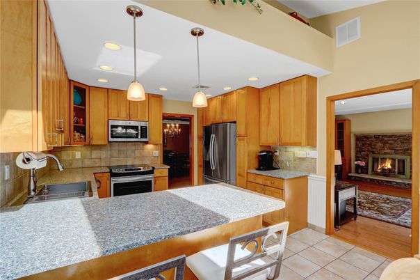 Fireplace, Interior, Kitchen, Pendant Lights, Recessed Lighting, Stainless Steel Appliances, Wood Texture Flooring