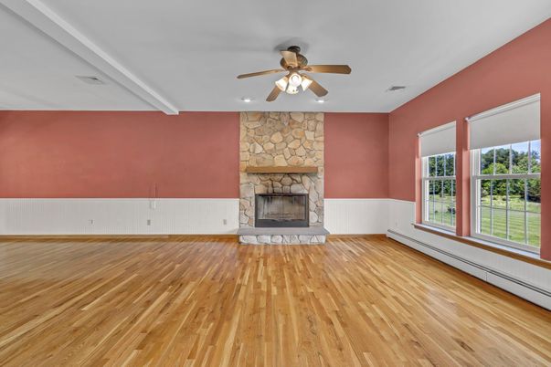 Empty room, Fireplace, Interior, Recessed Lighting, Stone Walls, Wood Texture Flooring
