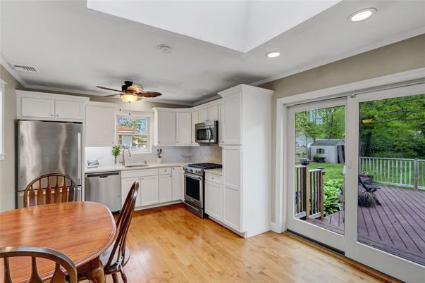 Dining room, Interior, Kitchen, Recessed Lighting, Stainless Steel Appliances, Wood Texture Flooring