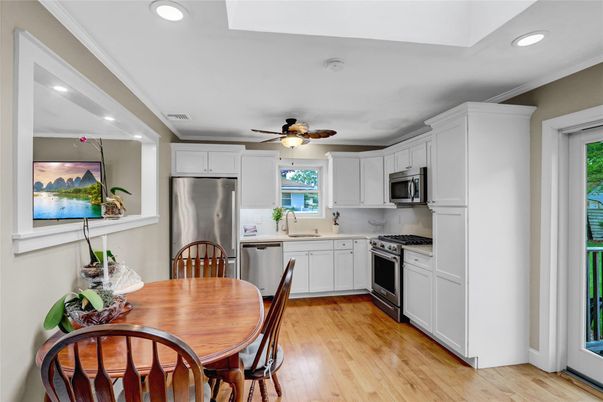 Dining room, Interior, Kitchen, Recessed Lighting, Stainless Steel Appliances, Wood Texture Flooring