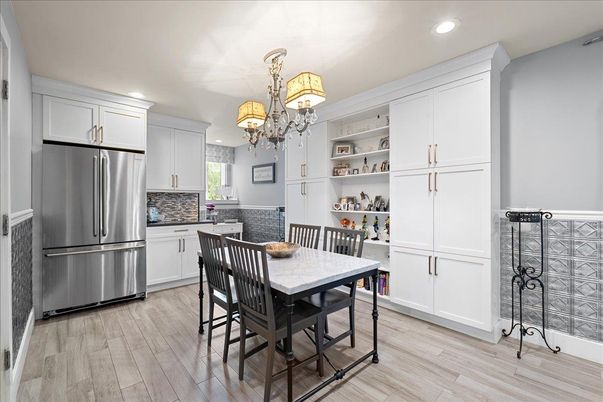 Chandelier, Dining room, Interior, Kitchen, Recessed Lighting, Stainless Steel Appliances, Wood Texture Flooring