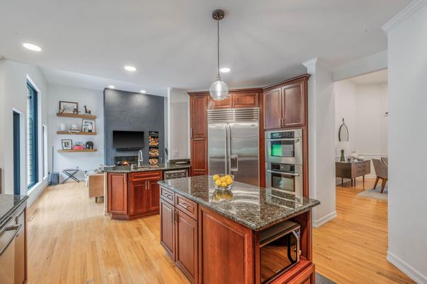 Dining room, Fireplace, Interior, Kitchen, Pendant Lights, Recessed Lighting, Stainless Steel Appliances, Wood Texture Flooring