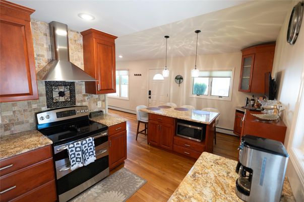 Interior, Kitchen, Pendant Lights, Recessed Lighting, Stainless Steel Appliances, Stone Walls, Wood Texture Flooring