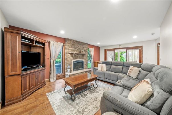 Fireplace, Interior, Living room, Recessed Lighting, Stone Walls, Wood Texture Flooring