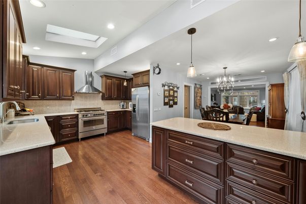 Chandelier, Dining room, Interior, Kitchen, Pendant Lights, Recessed Lighting, Stainless Steel Appliances, Wood Texture Flooring