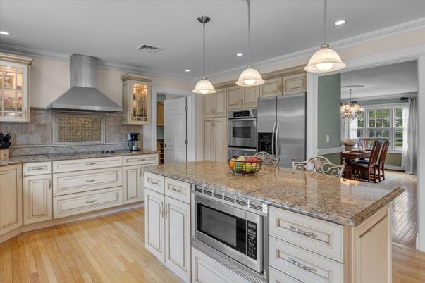 Dining room, Interior, Kitchen, Pendant Lights, Recessed Lighting, Stainless Steel Appliances, Wood Texture Flooring