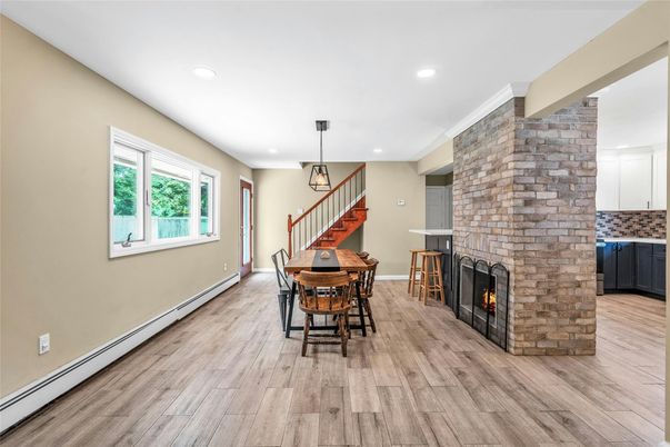 Dining room, Fireplace, Interior, Pendant Lights, Recessed Lighting, Stone Walls, Wood Texture Flooring