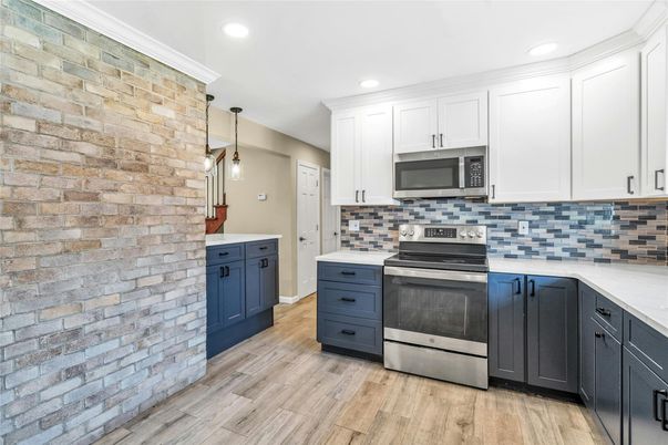 Interior, Kitchen, Pendant Lights, Recessed Lighting, Stainless Steel Appliances, Stone Walls, Wood Texture Flooring