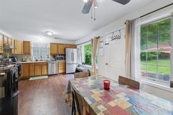 Dining room, Interior, Kitchen, Stainless Steel Appliances, Tile Countertops, Wood Texture Flooring