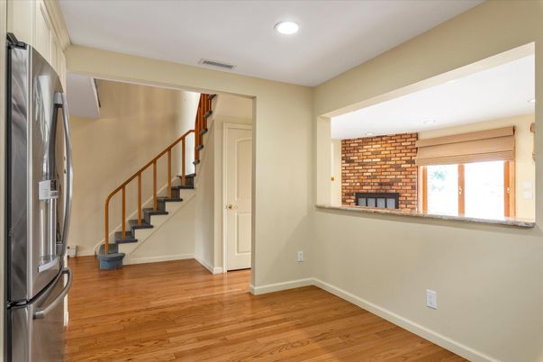 Empty room, Fireplace, Interior, Recessed Lighting, Stone Walls, Wood Texture Flooring