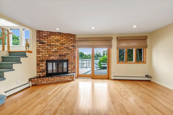 Empty room, Fireplace, Interior, Recessed Lighting, Stone Walls, Wood Texture Flooring