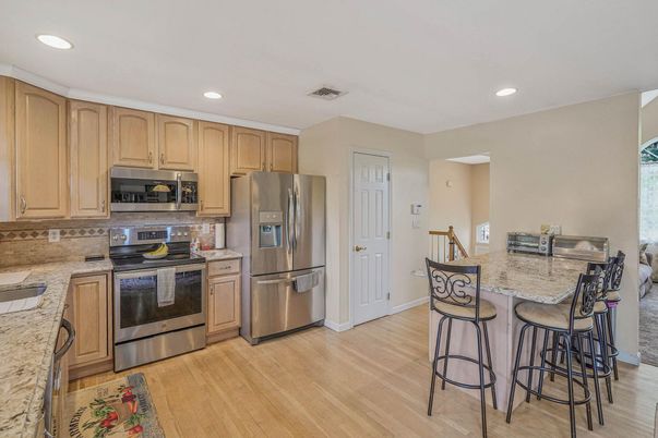 Interior, Kitchen, Recessed Lighting, Stainless Steel Appliances, Wood Texture Flooring