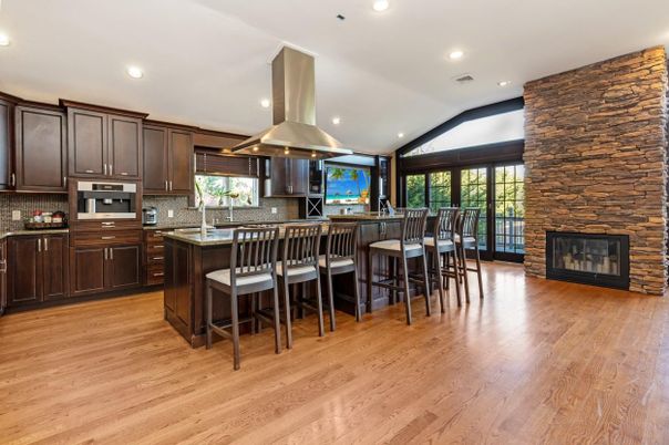 Fireplace, Interior, Kitchen, Recessed Lighting, Stone Walls, Wood Texture Flooring