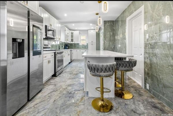 Interior, Kitchen, Marble, Marble Walls, Pendant Lights, Recessed Lighting, Stainless Steel Appliances