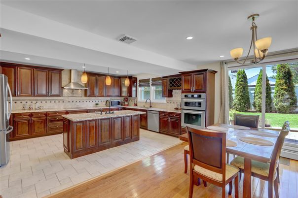 Dining room, Interior, Kitchen, Pendant Lights, Recessed Lighting, Stainless Steel Appliances, Wood Texture Flooring