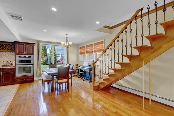 Chandelier, Dining room, Interior, Kitchen, Piano, Recessed Lighting, Stainless Steel Appliances, Wood Texture Flooring