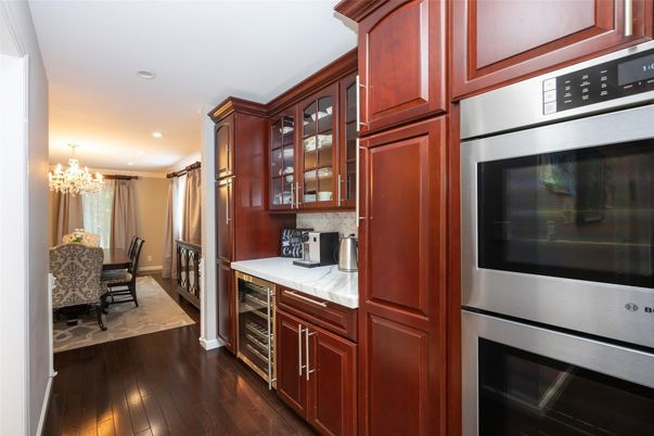 Chandelier, Dining room, Interior, Kitchen, Recessed Lighting, Stainless Steel Appliances, Tile Countertops, Wood Texture Flooring