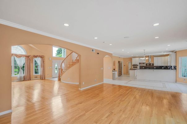 Empty room, Interior, Kitchen, Pendant Lights, Recessed Lighting, Stainless Steel Appliances, Wood Texture Flooring