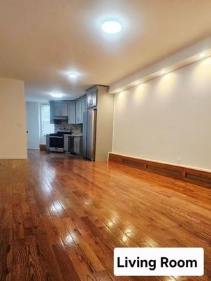 Empty room, Interior, Kitchen, Recessed Lighting, Stainless Steel Appliances, Wood Texture Flooring