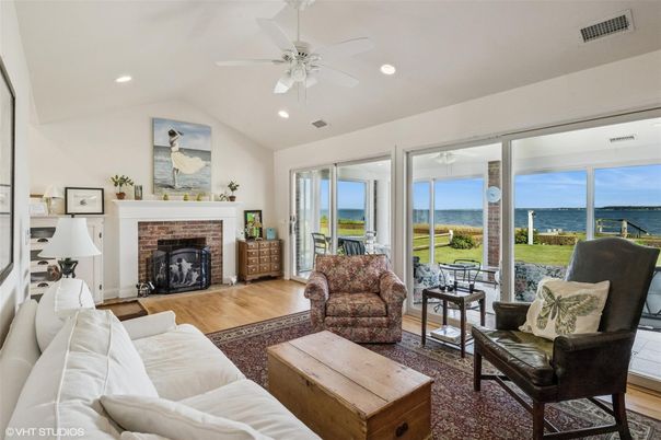 Fireplace, Interior, Living room, Recessed Lighting, Water, Wood Texture Flooring