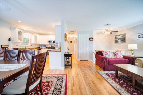 Dining room, Interior, Kitchen, Living room, Recessed Lighting, Stainless Steel Appliances, Wood Texture Flooring
