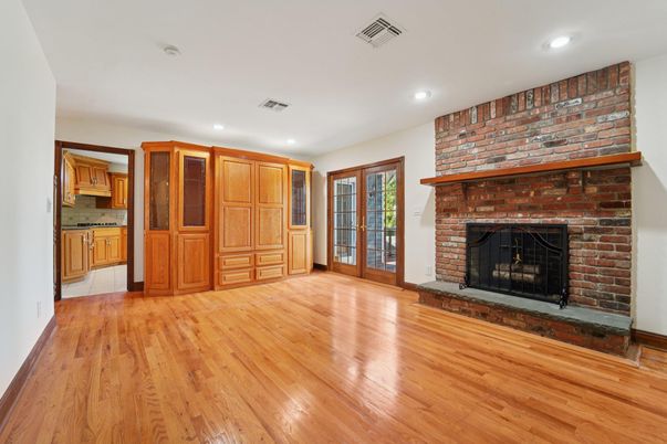 Empty room, Fireplace, Interior, Recessed Lighting, Stone Walls, Wood Texture Flooring