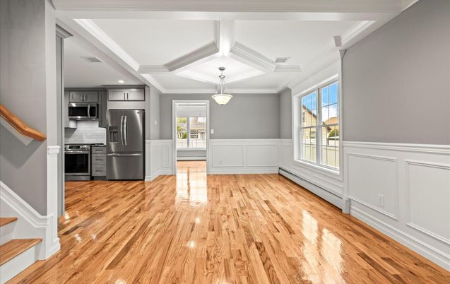 Empty room, Interior, Kitchen, Pendant Lights, Recessed Lighting, Stainless Steel Appliances, Wood Texture Flooring