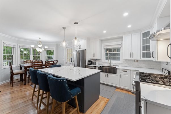 Dining room, Interior, Kitchen, Pendant Lights, Recessed Lighting, Stainless Steel Appliances, Wood Texture Flooring