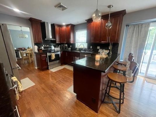 Dining room, Interior, Kitchen, Pendant Lights, Recessed Lighting, Stainless Steel Appliances, Wood Texture Flooring