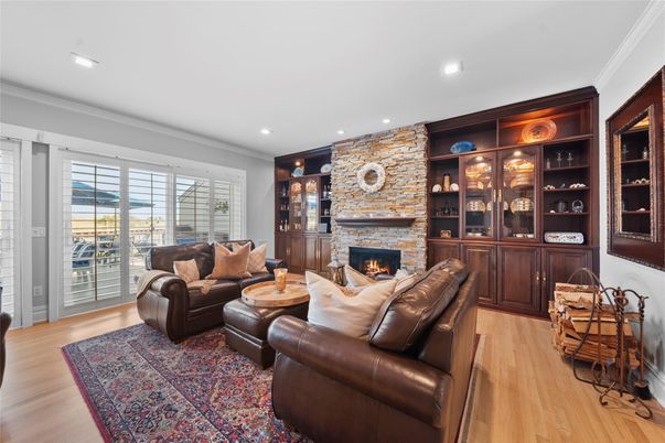 Fireplace, Interior, Living room, Recessed Lighting, Stone Walls, Wood Texture Flooring