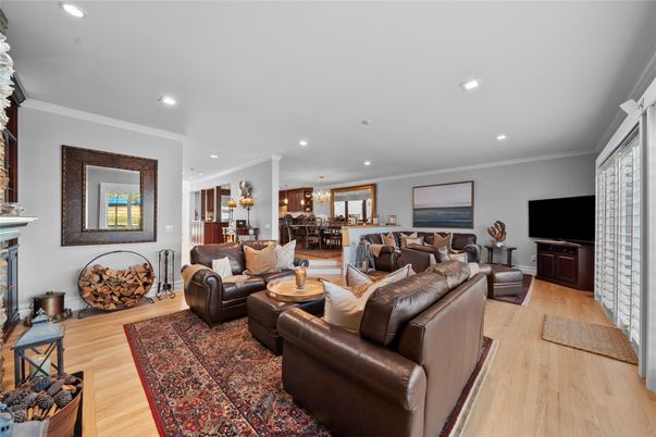 Dining room, Fireplace, Interior, Living room, Recessed Lighting, Wood Texture Flooring