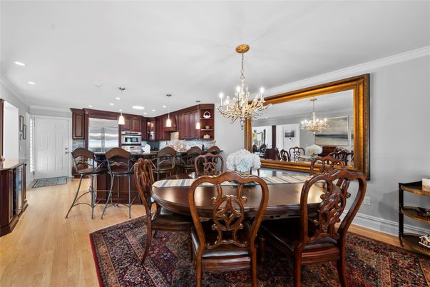 Chandelier, Dining room, Interior, Kitchen, Recessed Lighting, Stainless Steel Appliances, Wood Texture Flooring