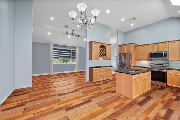 Chandelier, Interior, Kitchen, Recessed Lighting, Stainless Steel Appliances, Wood Texture Flooring