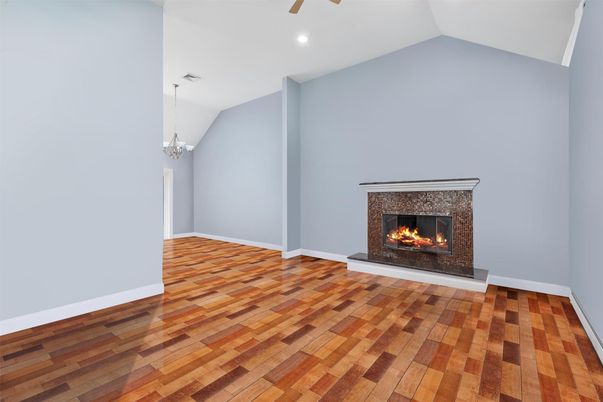 Chandelier, Empty room, Fireplace, Interior, Recessed Lighting, Wood Texture Flooring
