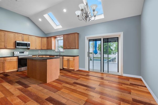 Chandelier, Interior, Kitchen, Recessed Lighting, Stainless Steel Appliances, Wood Texture Flooring