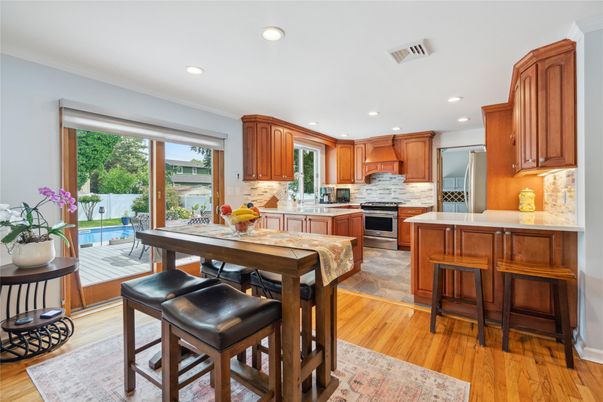 Dining room, Interior, Kitchen, Recessed Lighting, Stainless Steel Appliances, Wood Texture Flooring
