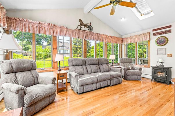 Fireplace, Interior, Living room, Recessed Lighting, Sun Room, Wood Texture Flooring