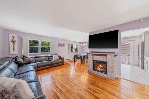 Dining room, Fireplace, Interior, Living room, Pendant Lights, Recessed Lighting, Wood Texture Flooring