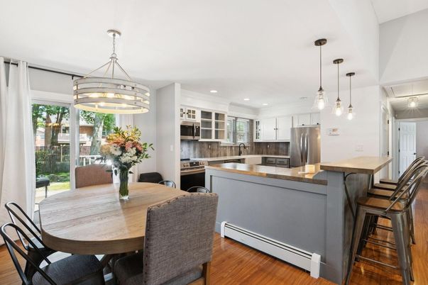 Dining room, Interior, Kitchen, Pendant Lights, Recessed Lighting, Stainless Steel Appliances, Wood Texture Flooring