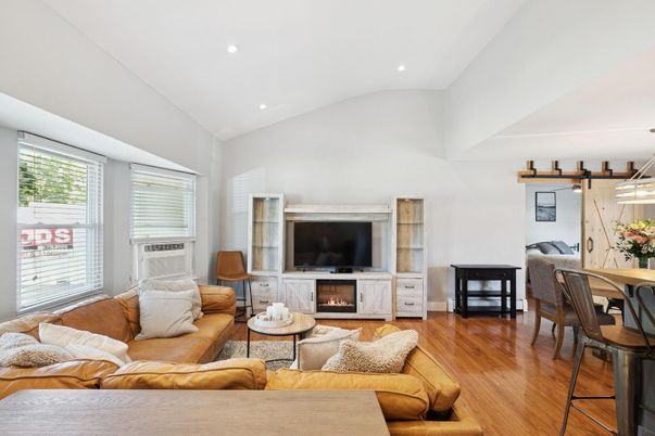 Dining room, Fireplace, Interior, Living room, Recessed Lighting, Wood Texture Flooring